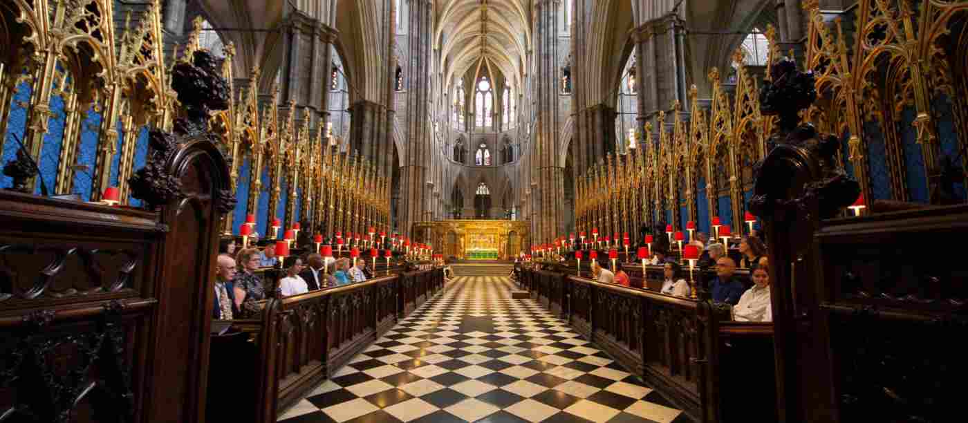 The Quire - black and white floor with sets of stalls eithers ide of the walkway