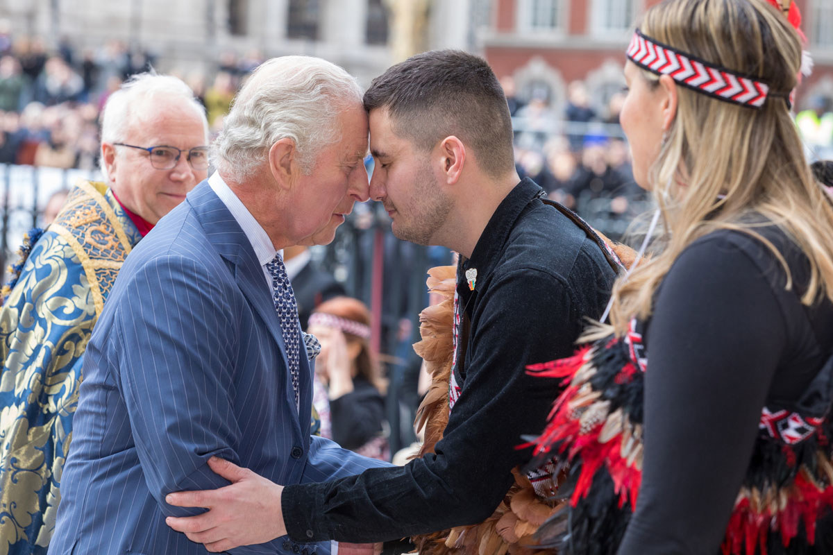HM King Charles III rubbing noses (a traditional Maori greeting) with a member of the Ngati Ranana