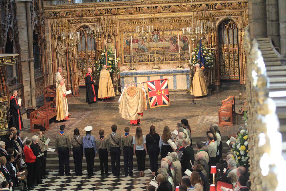 Scout and Guide flags are presented and placed on the High Altar