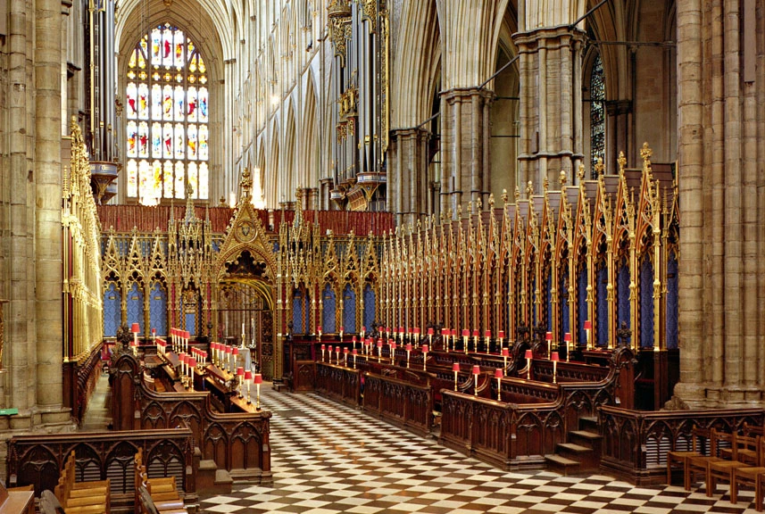 The Quire of the Abbey - wooden stalls opposite each other with a chess-style floor.