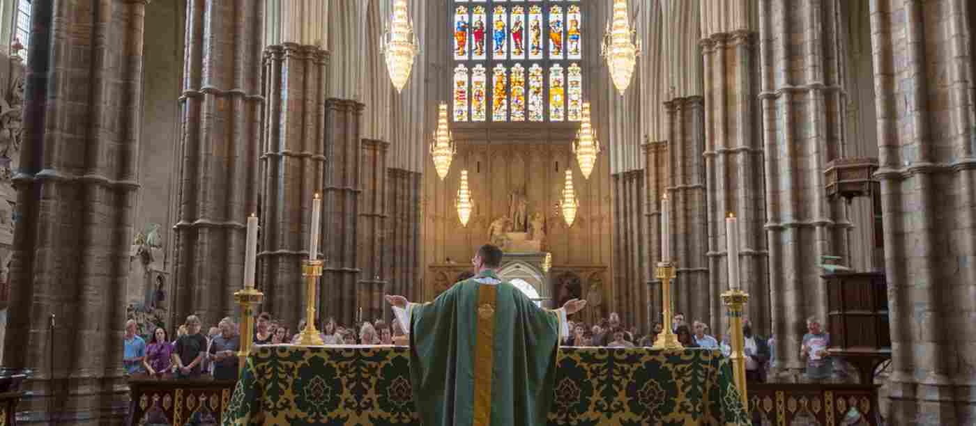 A service as seen from behind the Reverend and altar