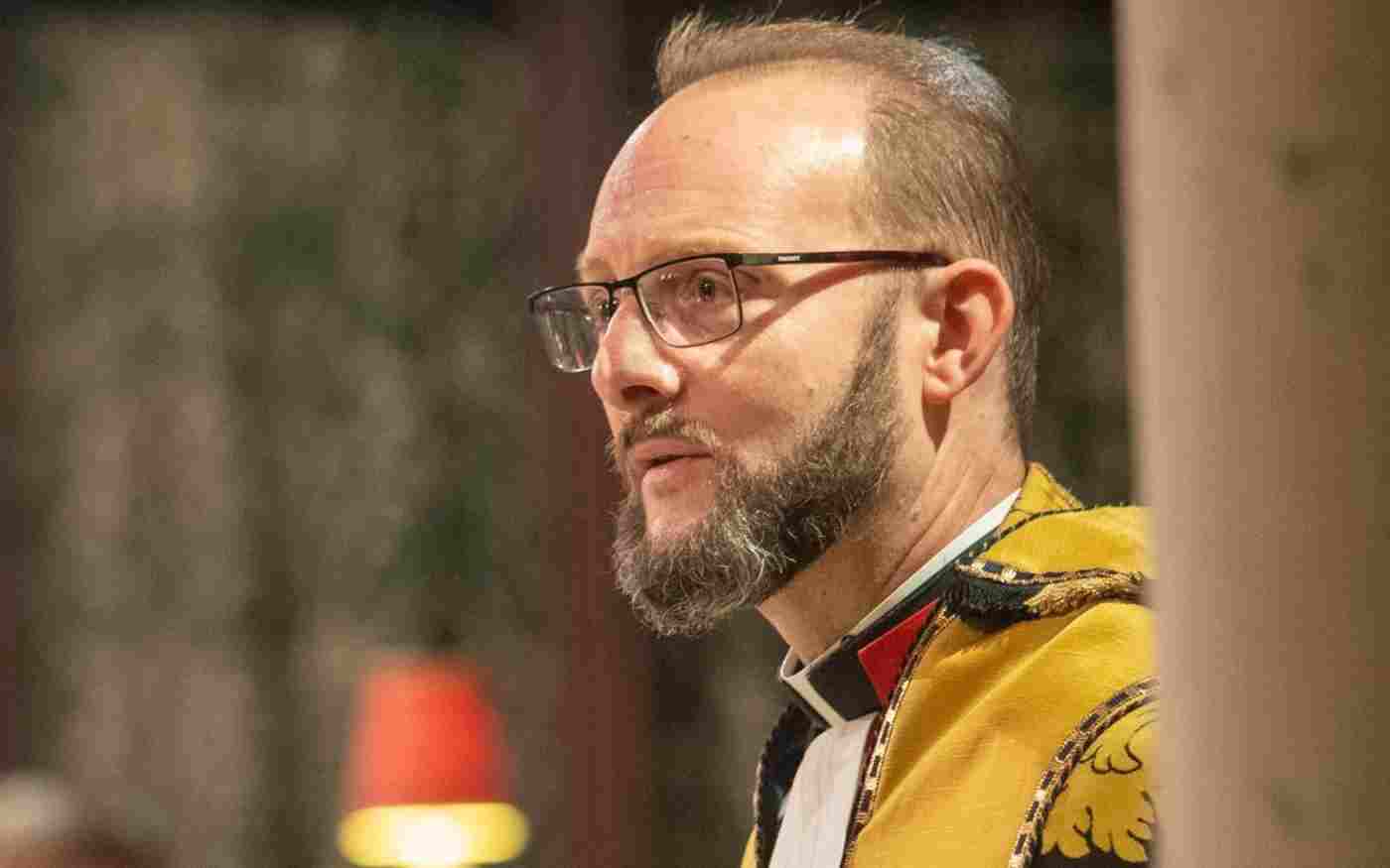 Canon Anthony Ball during a service