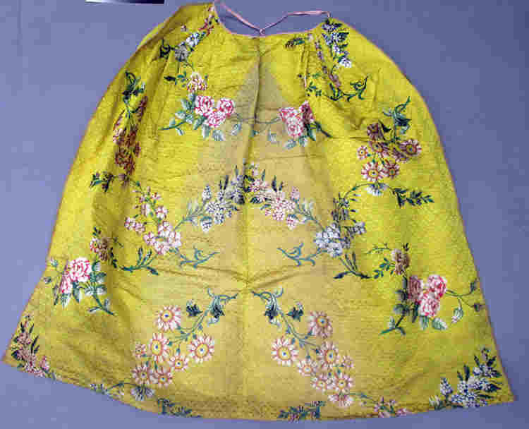 Queen's Anne's yellow petticoat with pink and white flowers on her wax effigy
