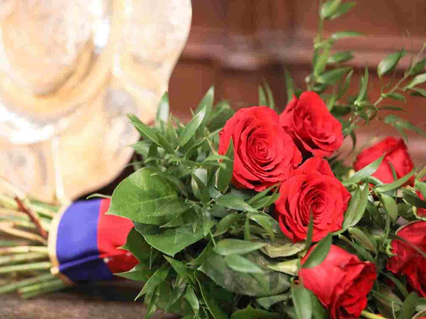 A tribute of red roses from The Queen was placed on the altar