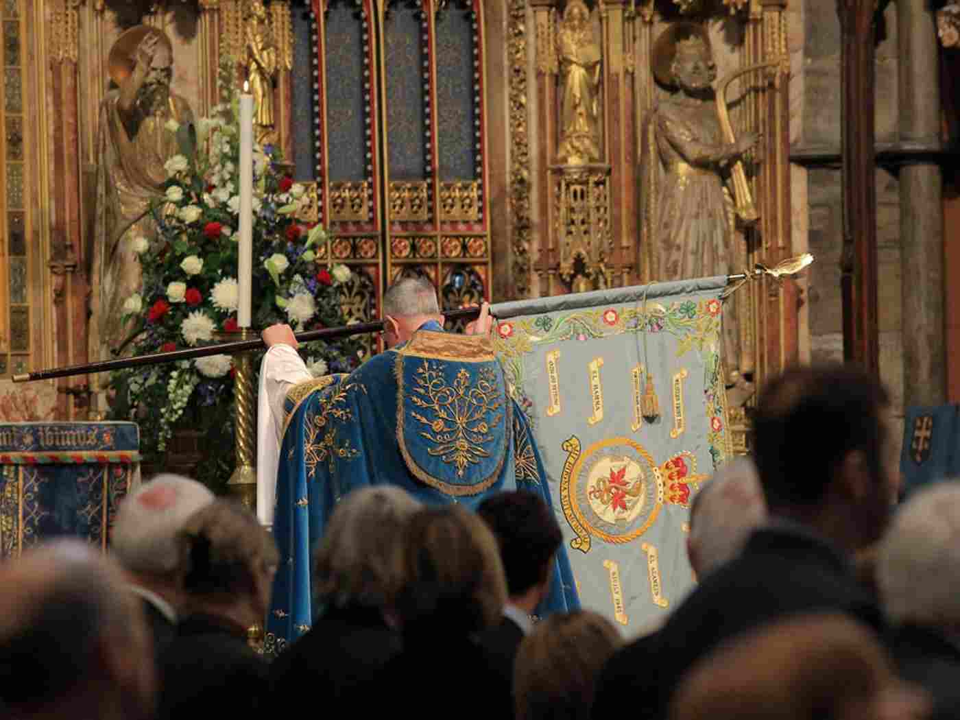 The Standard of No 92 Squadron of the Royal Air Force is borne through the church and presented at the High Altar