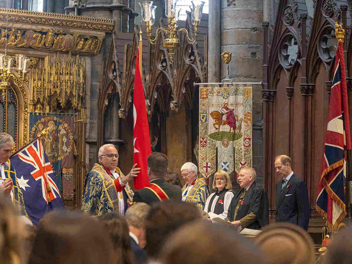 The flags of New Zealand, Australia, Turkey and the UK are processed through the Abbey