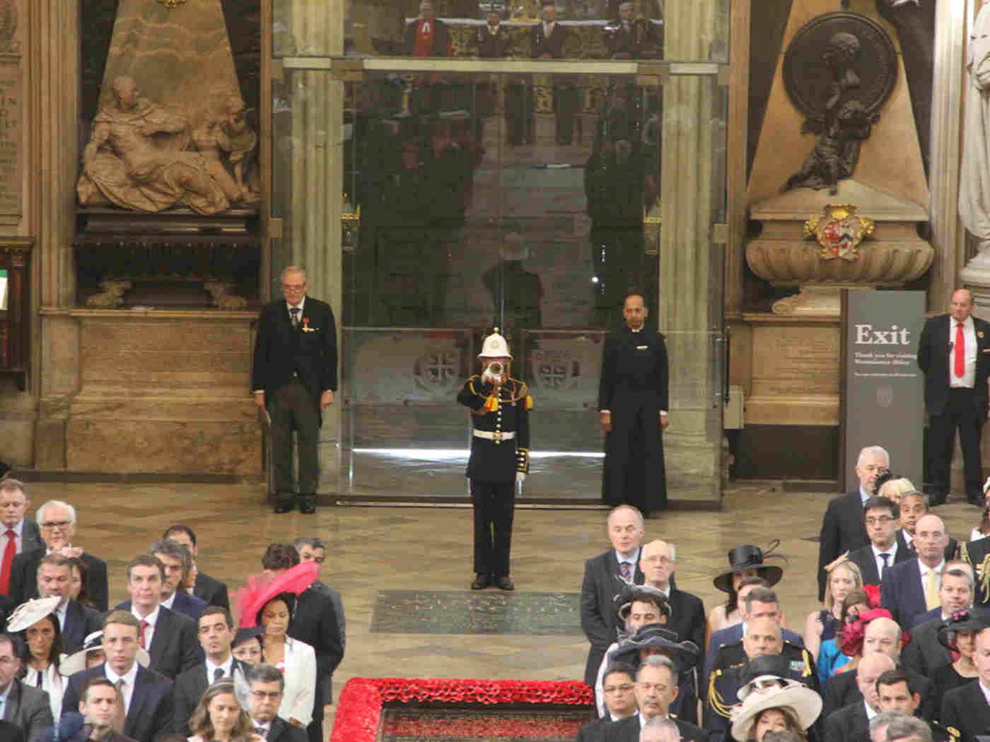 A Royal Navy trumpeter sounds a trumpet call