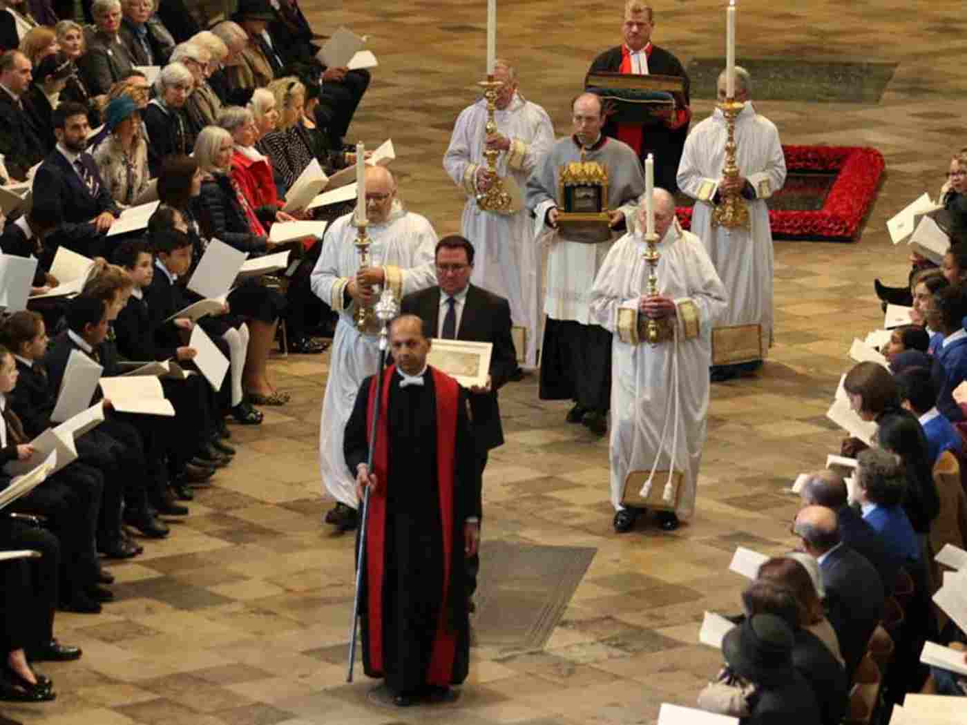 Historic documents and reliquary are processed through the Abbey church