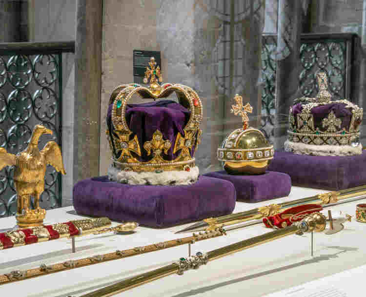 Photograph of regalia replicas, including crowns, orb and ampulla within the Queen Diamond Jubilee Gallery at Westminster Abbey