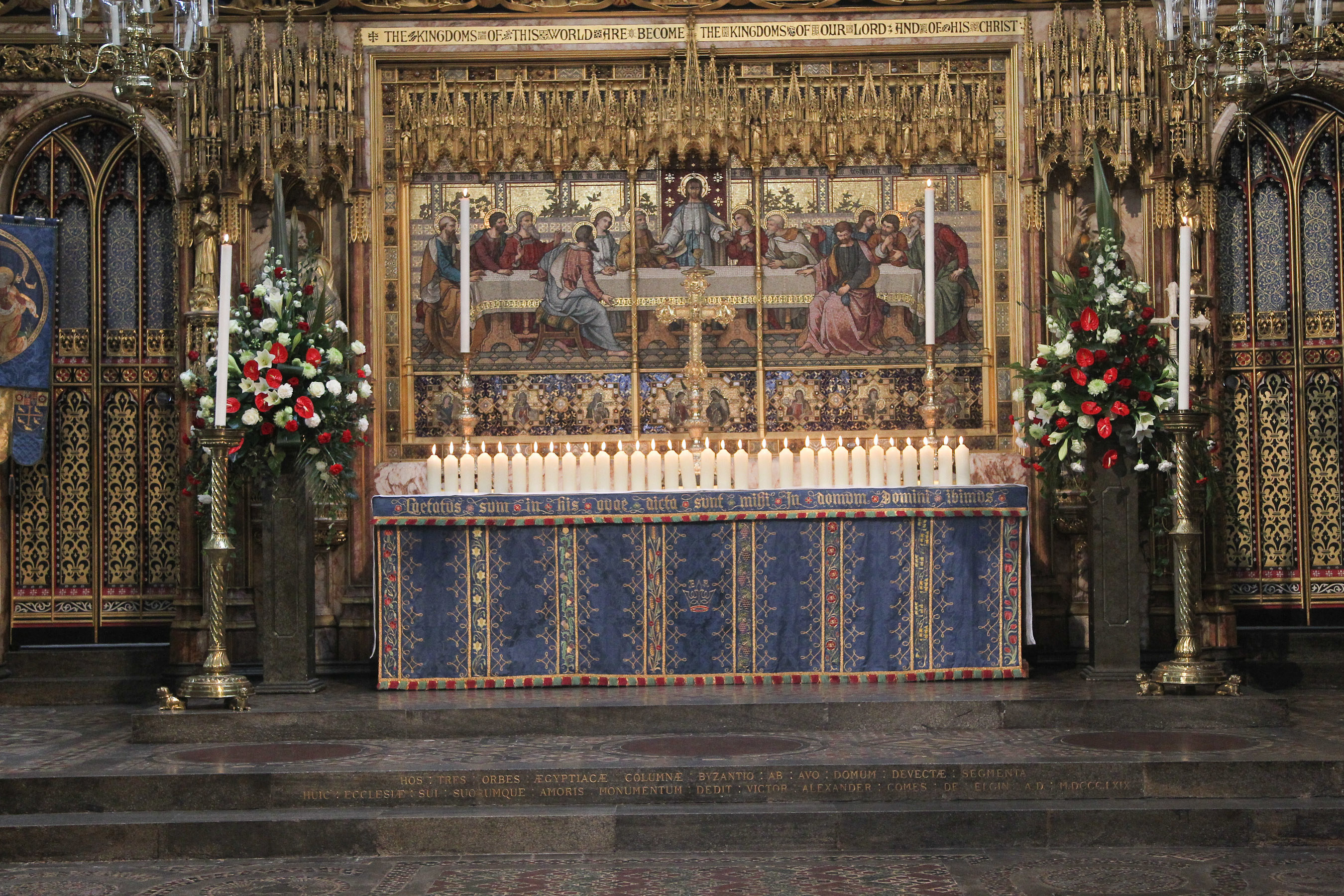 31 candles, each representing a life lost in the two attacks, were borne through the Abbey Church and placed on the High Altar