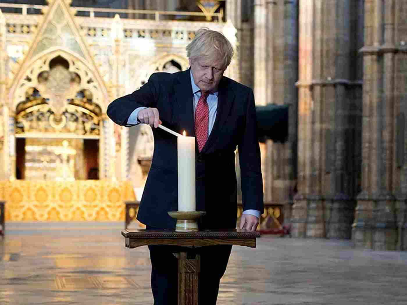 Prime Minister Boris Johnson lights a candle