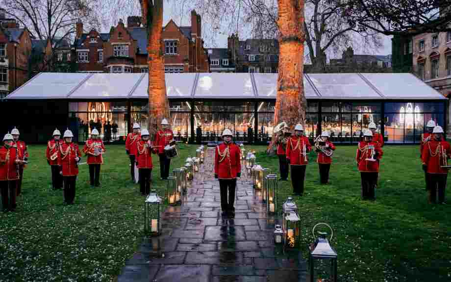 Royal guards standing outside a temporary dining facility in College Garden