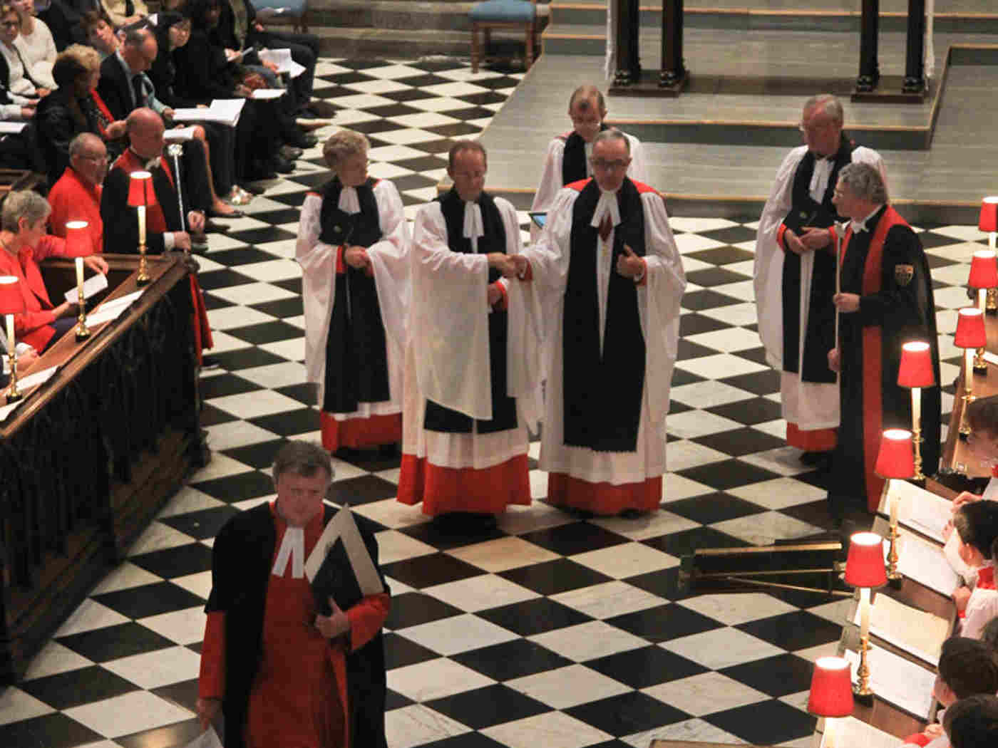 Canon Ball is led to his vacant stall in the Quire of the Abbey Church by the Dean of Westminster, the Very Reverend Dr John Hall