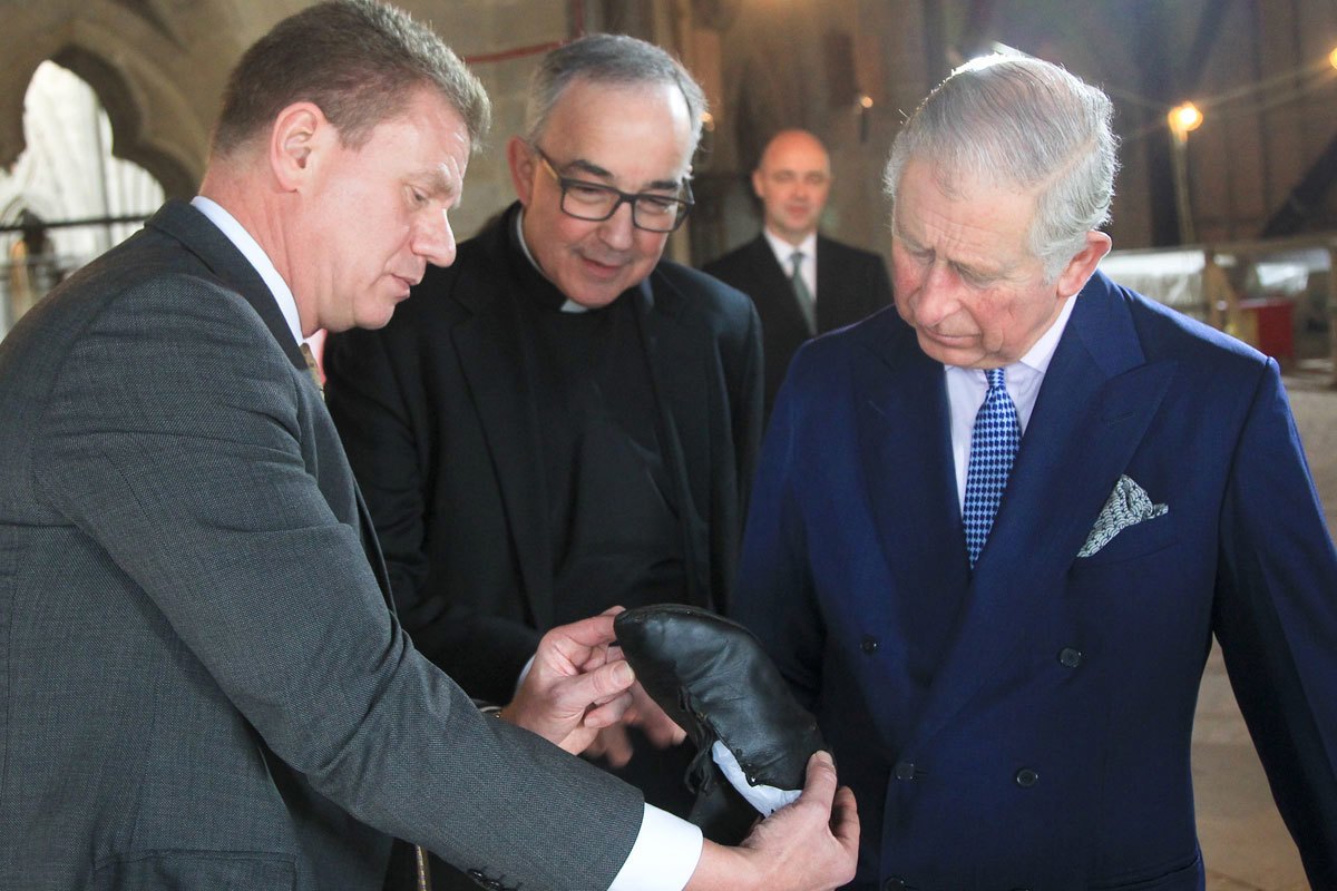 HRH The Prince of Wales is shown a medieval monk's shoe by the Head of the Abbey Collection, Dr Tony Trowles