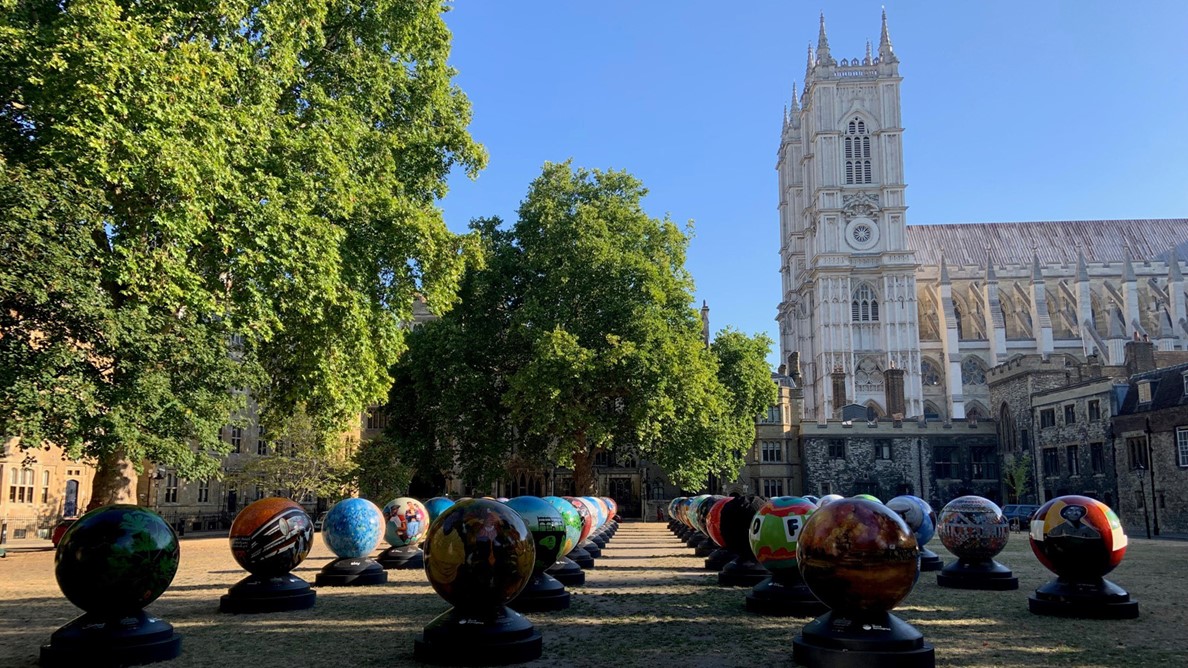 42 globes with various designs in Dean's Yard on a sunny day