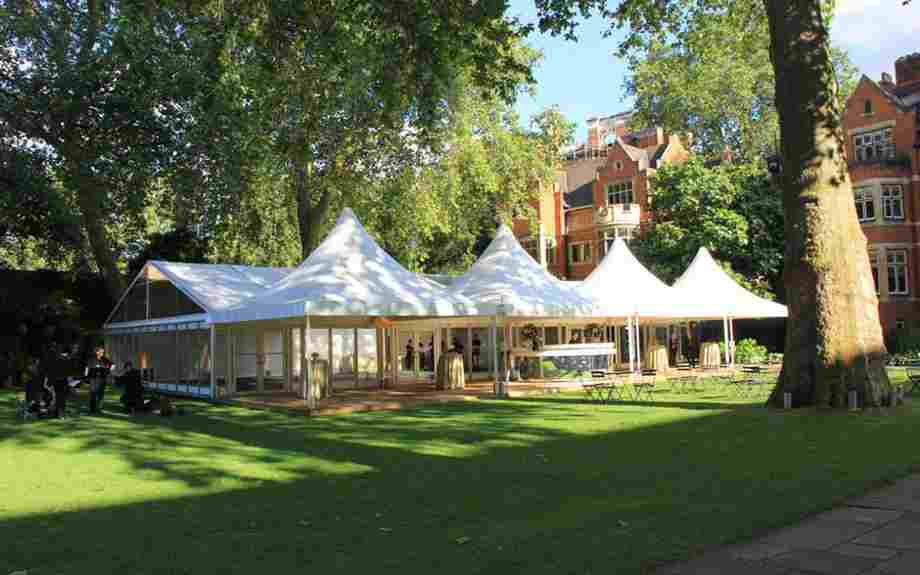 A large glass marquee on Westminster Abbey's College Garden lawn