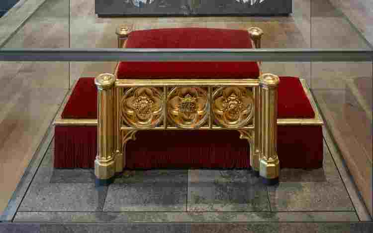 Gold framed footstool with red velvet cushions used at Queen Victoria's coronation