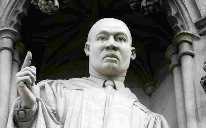 Photograph of modern martyr statue to Martin Luther King Jr above the Great West Doors of Westminster Abbey