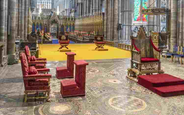 The Coronation Chair and Chairs of Estate set out for the coronation of Charles III.