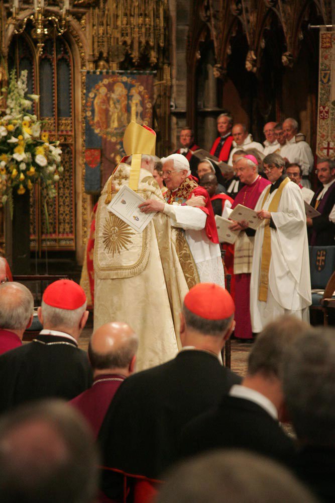 The Archbishop and the Pope exchange a sign of peace