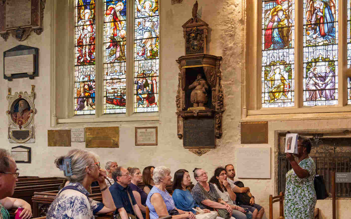 Photograph of members of the public listening to a speaker in St Margaret's Church at Westminster Abbey