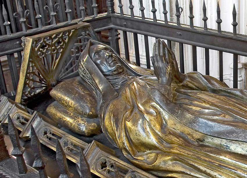 Gilt bronze effigy of Margaret Beaufort lying on her back with her hands raised in prayer