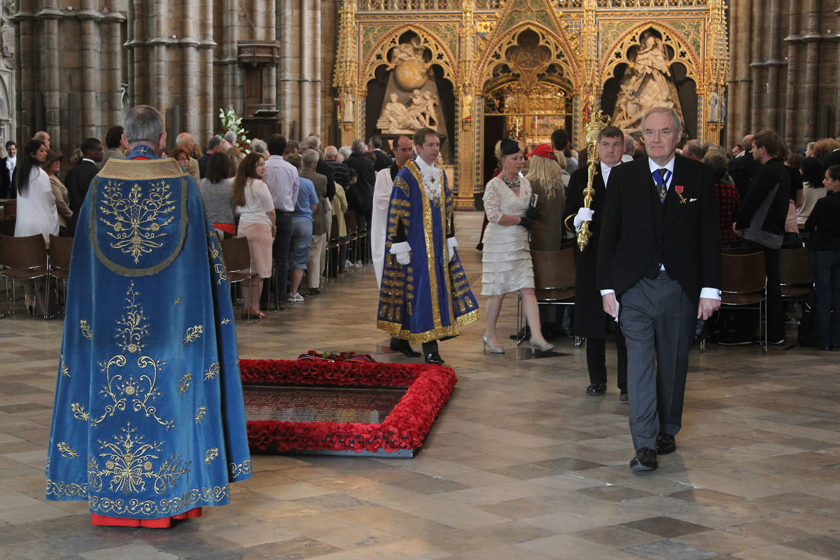The Dean of Westminster, the Very Reverend Dr John Hall, watches as The Lord Mayor of Westminster, Councillor Steve Summers passes the Grave of the Unknown Warrior