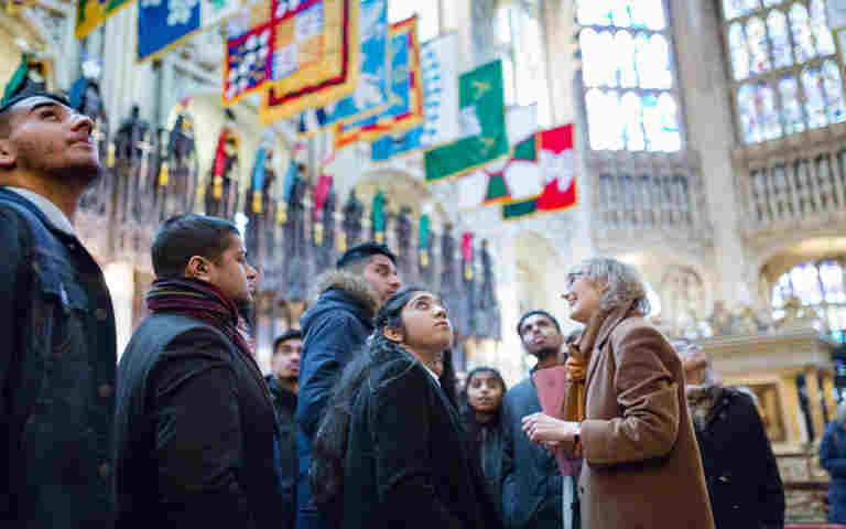 Photograph of secondary school students standing in the Lady Chapel as part of a guided tour of Westminster Abbey