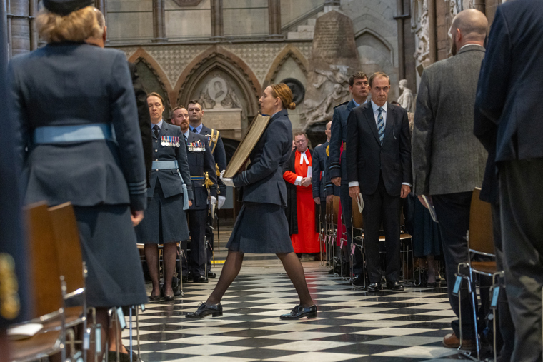 The roll of honour processing down the nave.
