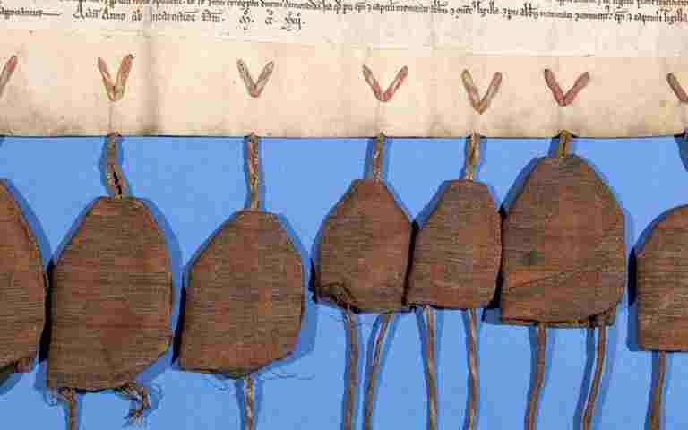 Seal bags attached to a manuscript in the collection of the Westminster Abbey Library