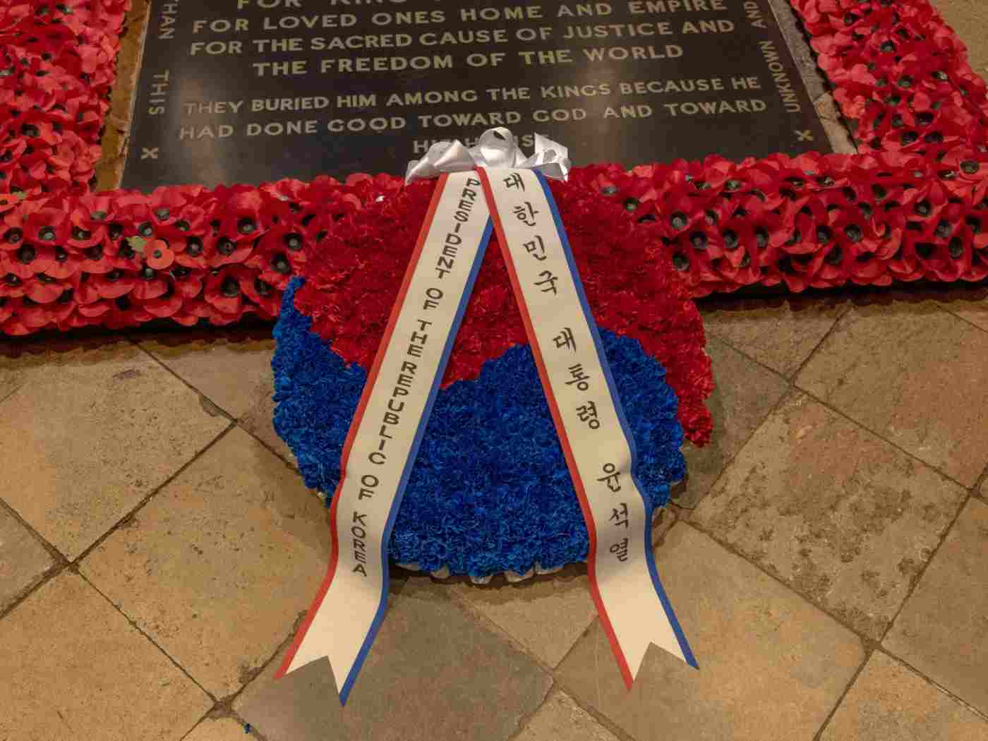 A blue and red wreath at the base of the Grave of the Unknown Warrior