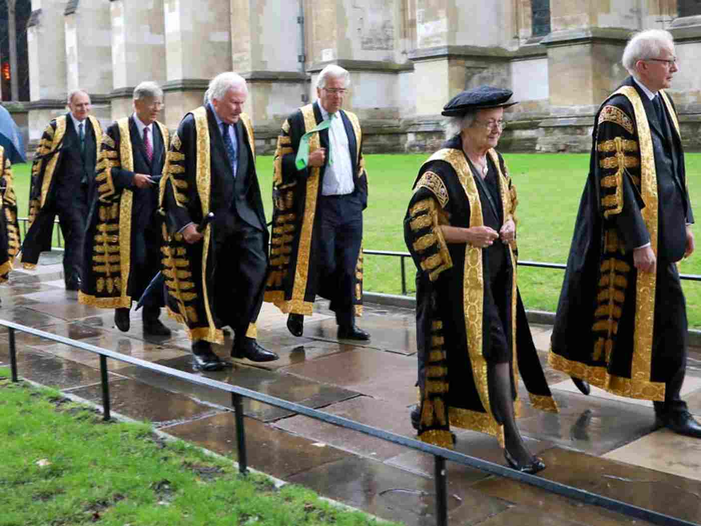 Members of the Supreme Court process over to the Abbey