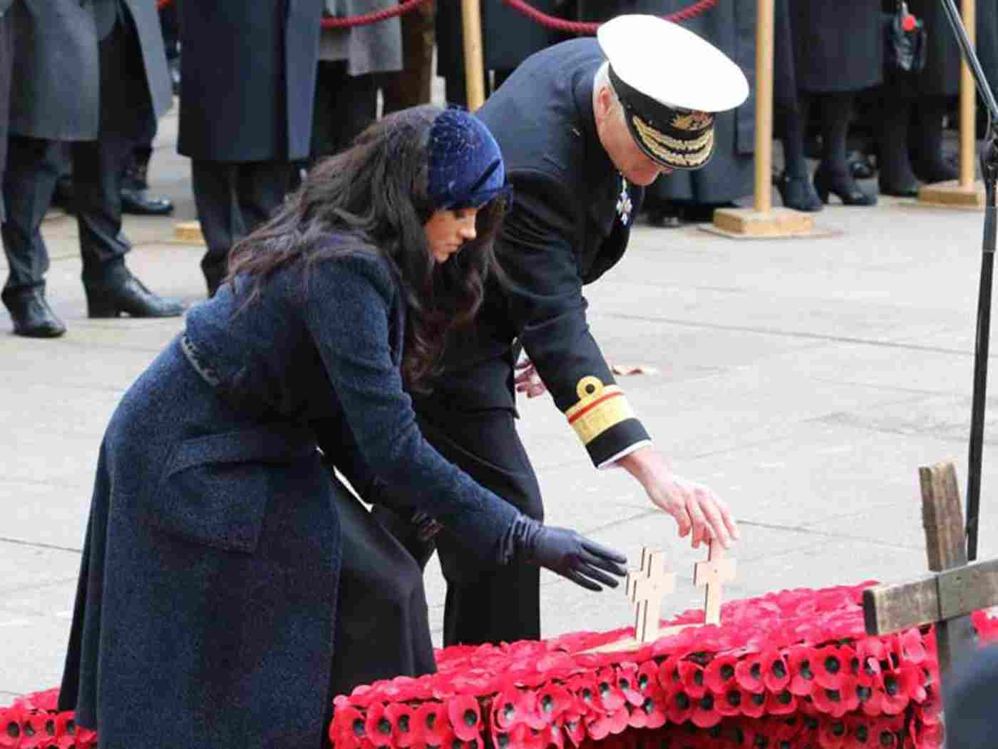 The Duchess of Sussex lays her memorial cross with RAdm Jarvis