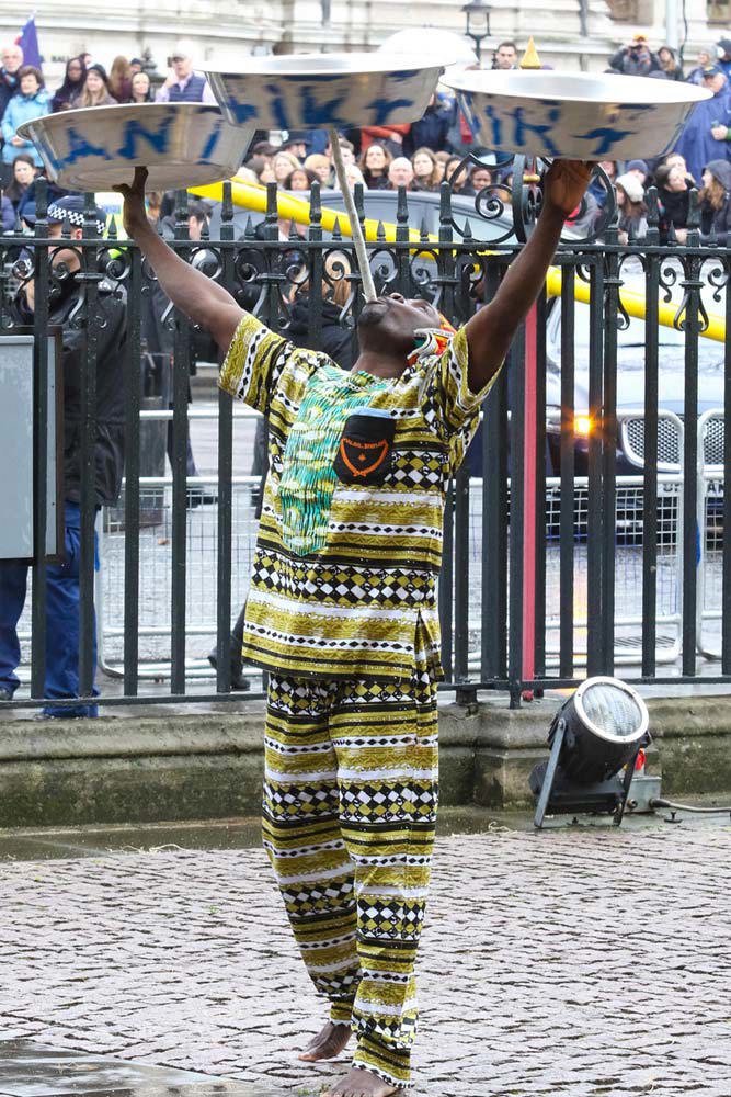 London-based Ghanaian musicians One-Drum perform outside the Abbey before the service