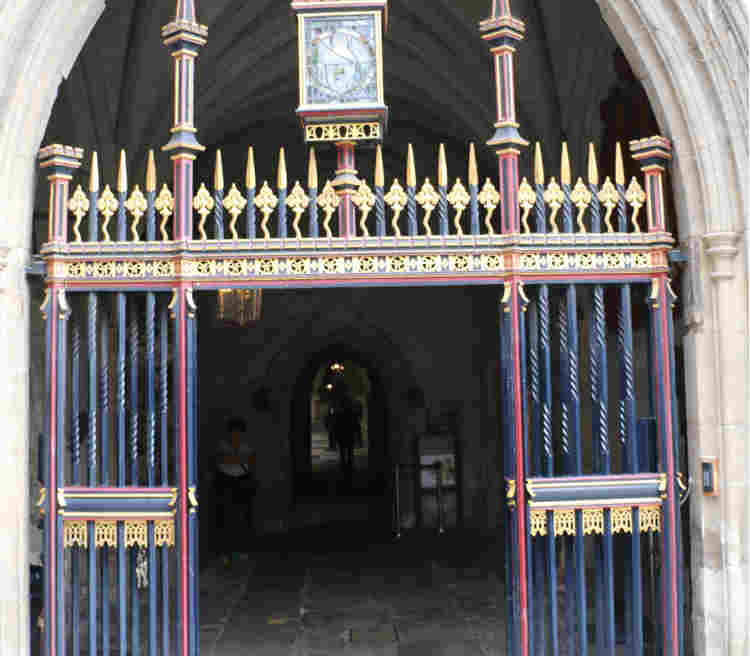 Photograph of the Cloister entrance in Dean's Yard in Westminster Abbey, a large open gate that leads into a cobbled pathway