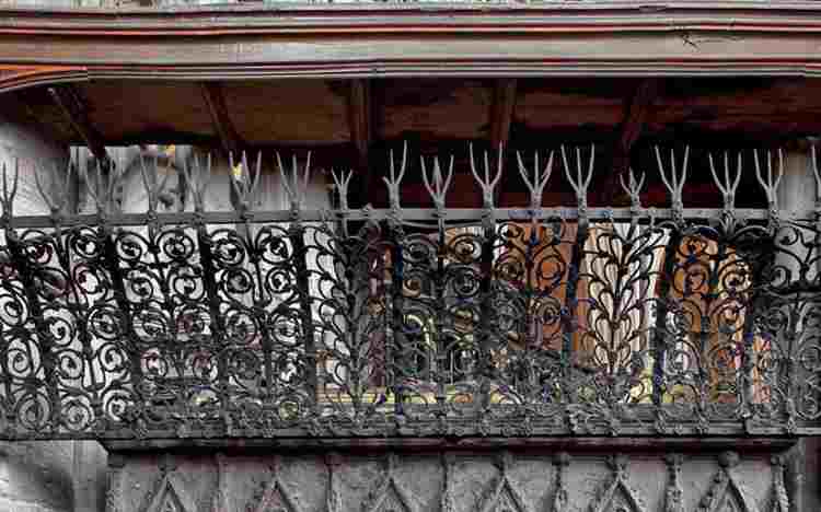 Detailed ironwork on one side of the tomb of Eleanor of Castile