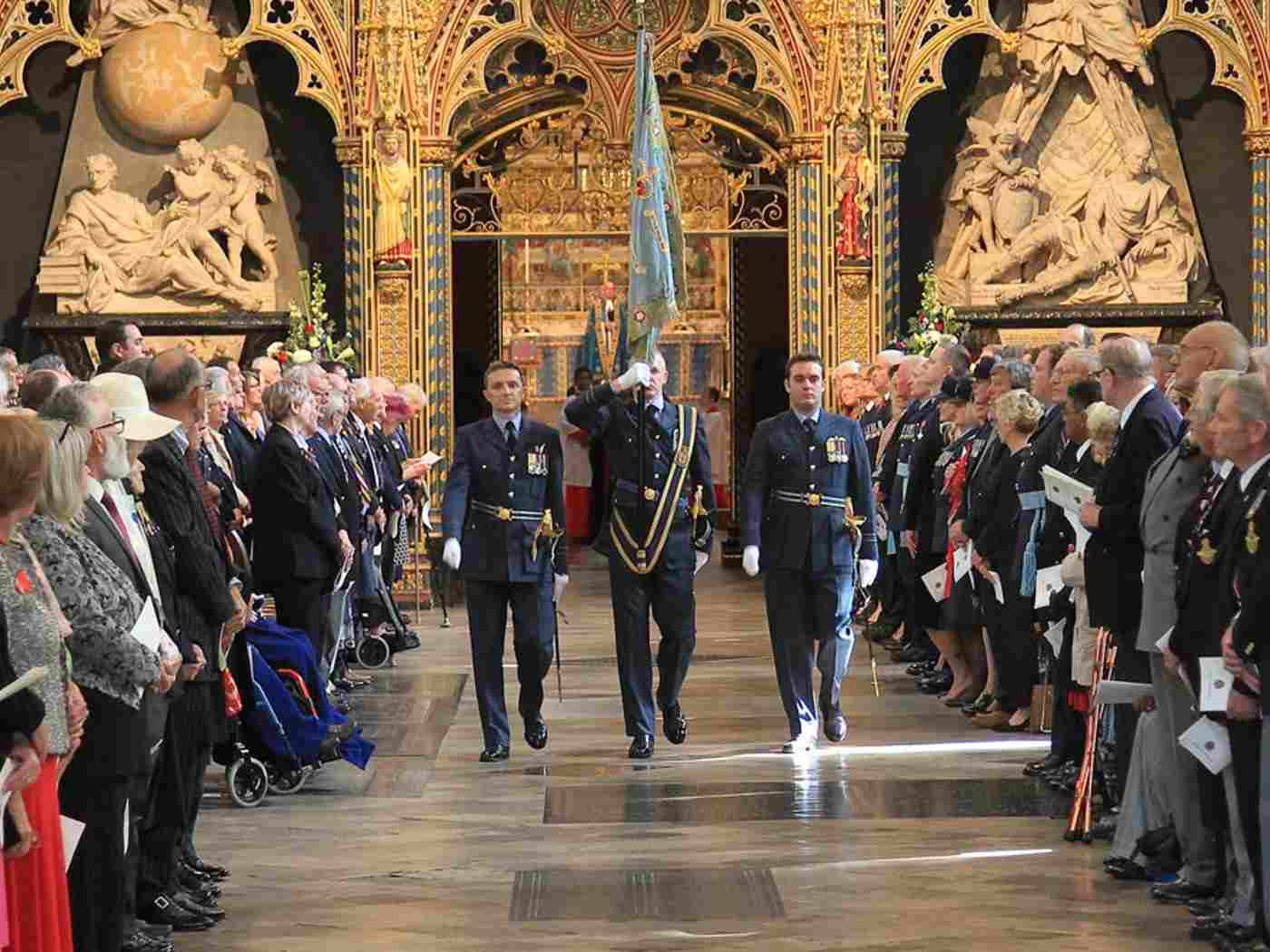The Standard of No 92 Squadron of the Royal Air Force is returned through the church