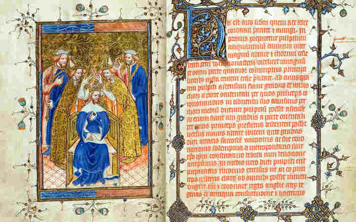 Photograph of two pages of the Liber Regalis, the guide to the coronations, on display at Westminster Abbey. The left illumination shows a king being crowned, surrounded by members of the clergy, while the right side shows a page of medieval Latin writing with an illustrative border.
