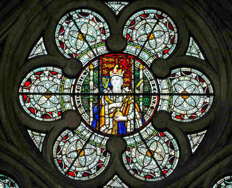 Photograph of a member of royalty in a stained glass window at Westminster Abbey, representing a lesson for KS2 school students on investigating royal funerals