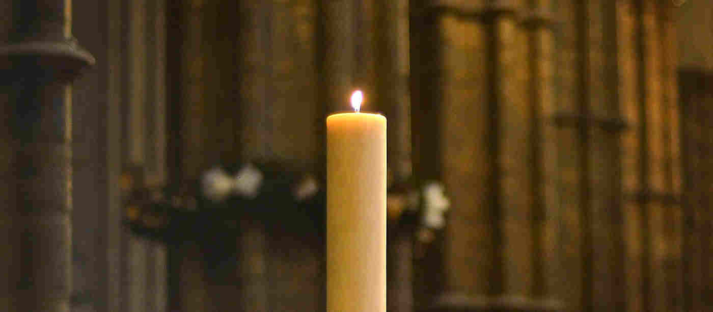 Lit candle in the Abbey