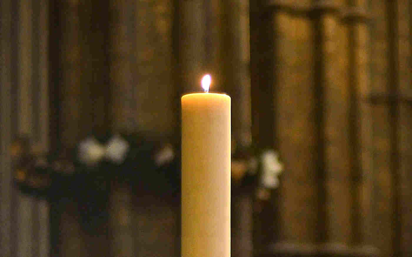 Lit candle in the Abbey