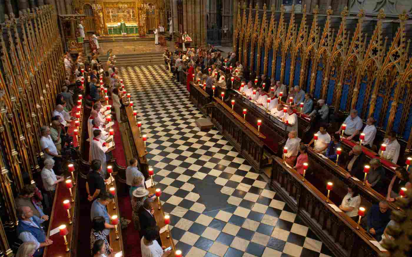The congregation standing in the quire stalls
