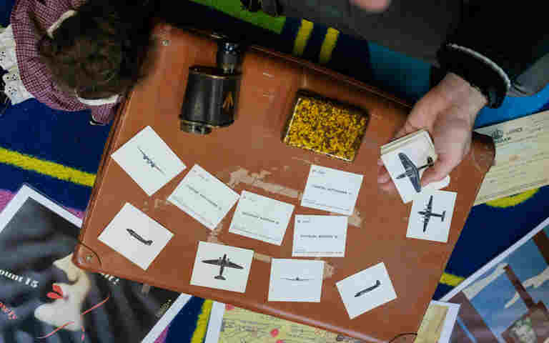 Close-up photograph of different cards being organised with lots of colours in the background representing an after school club from Westminster Abbey