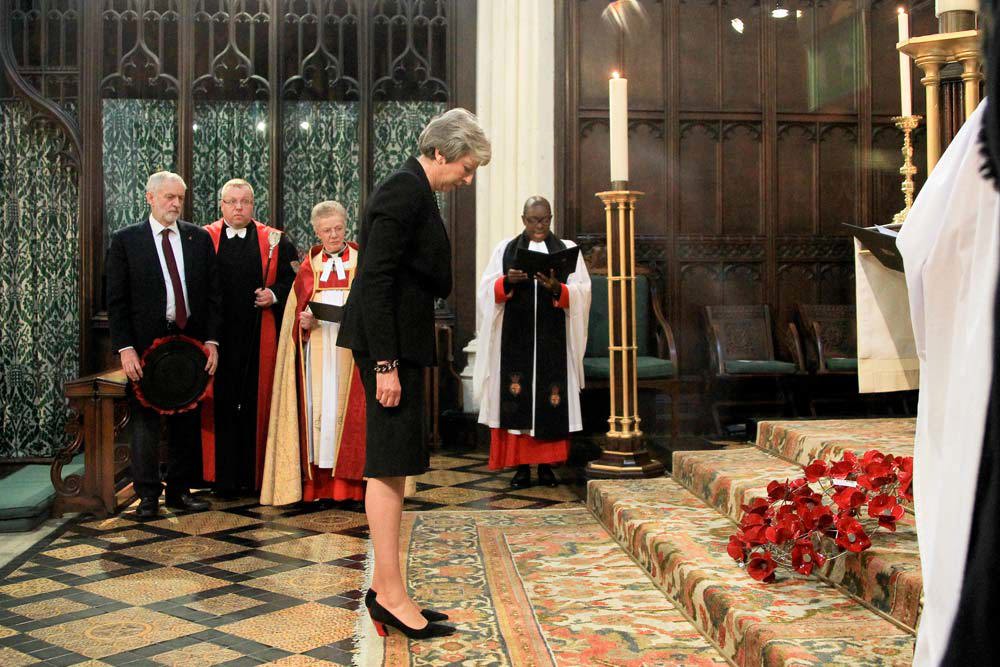 Prime Minister Theresa May lays a wreath