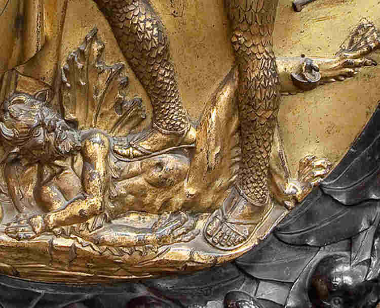 Photograph of the devil beneath St Michael's feet, part of Henry VII's tomb in Westminster Abbey, representing the evil and suffering teaching guide for secondary teachers
