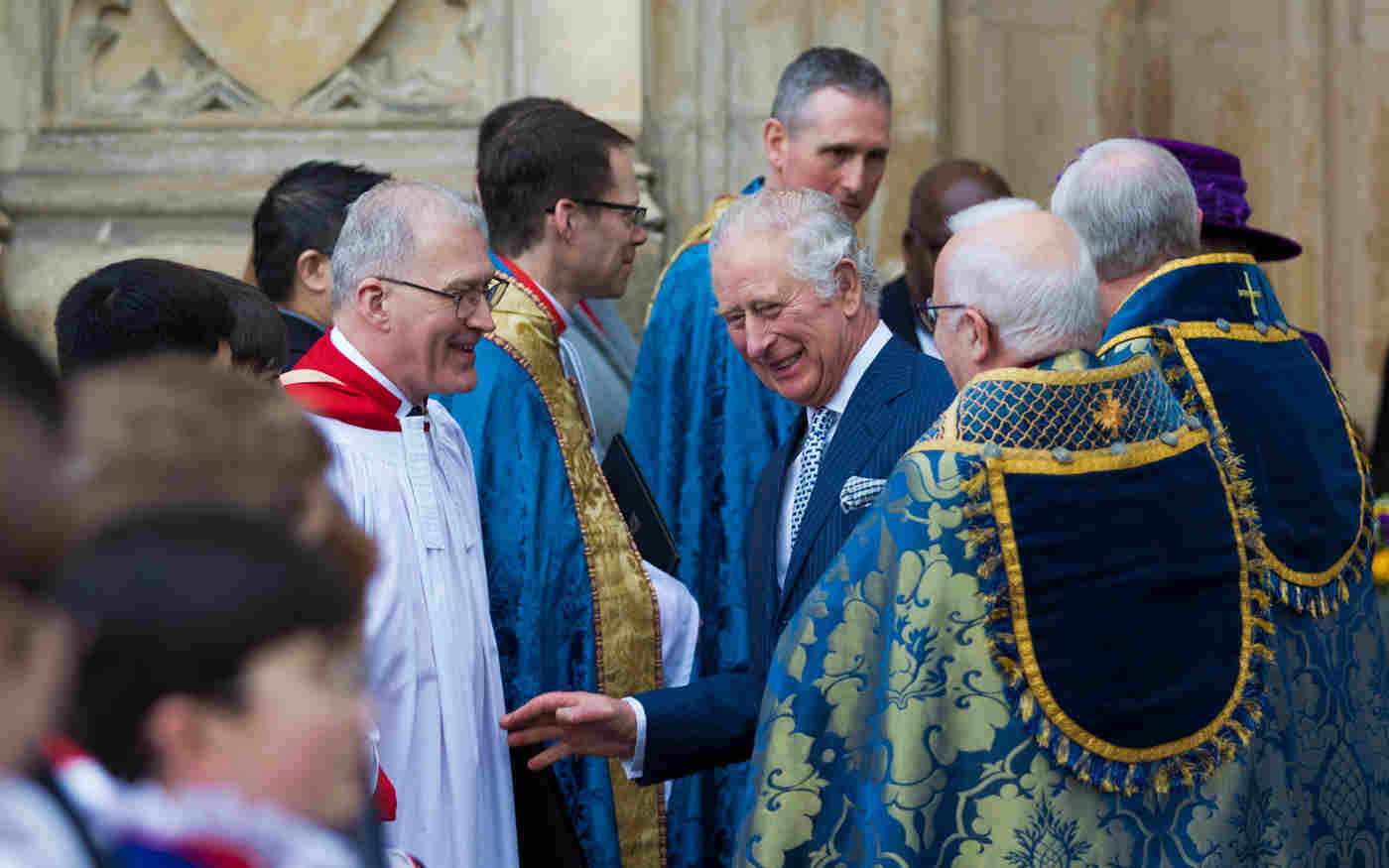 James O'Donnell smiling along with King Charles outside Westminster Abbey