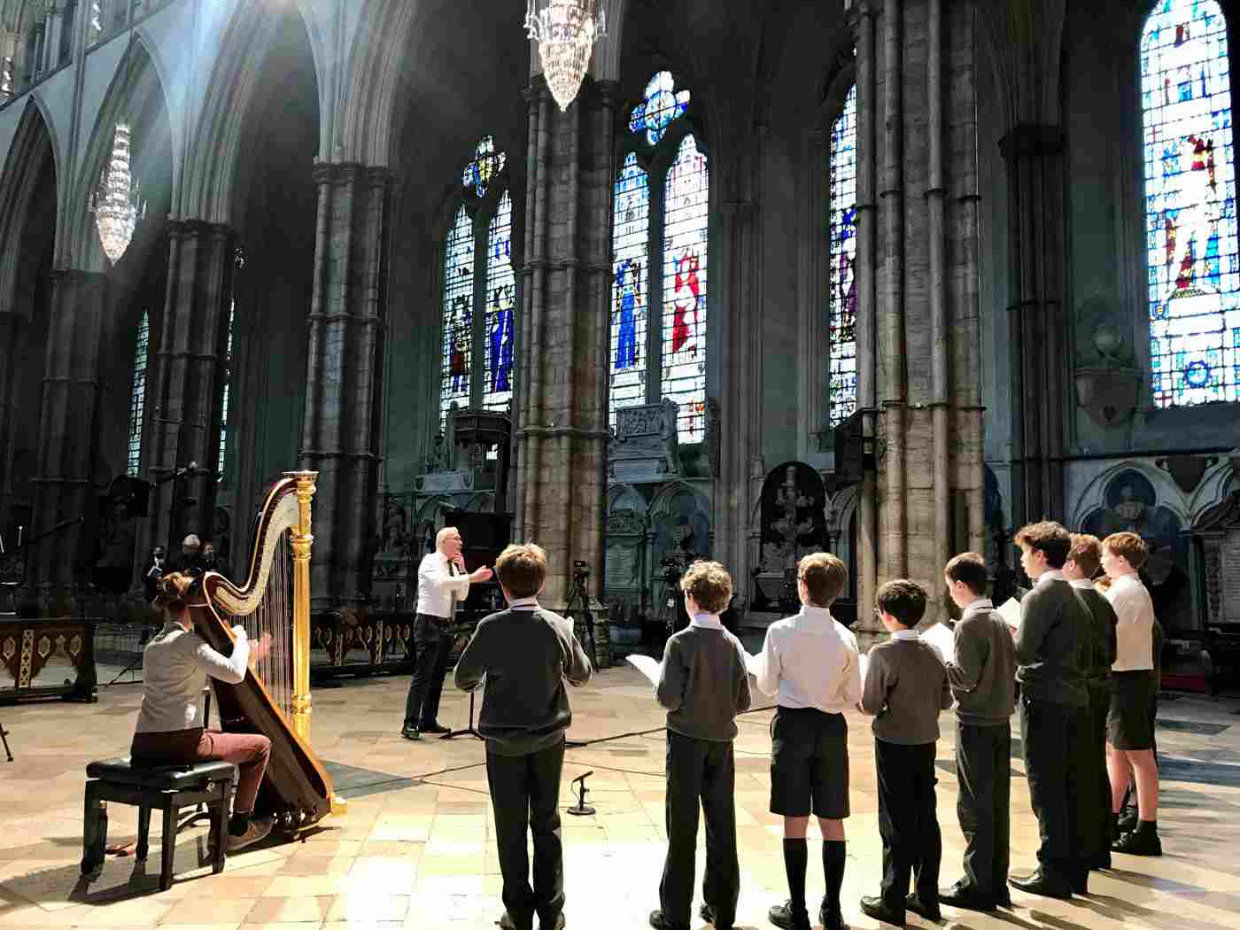 Harpist Sally Pryce rehearses with the Abbey choristers and Organist & Master of the Choristers James O'Donnell