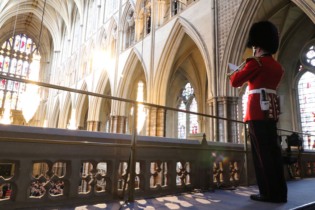 A member of the Coldstream Guard plays the Last Post in the Abbey's Organ Loft