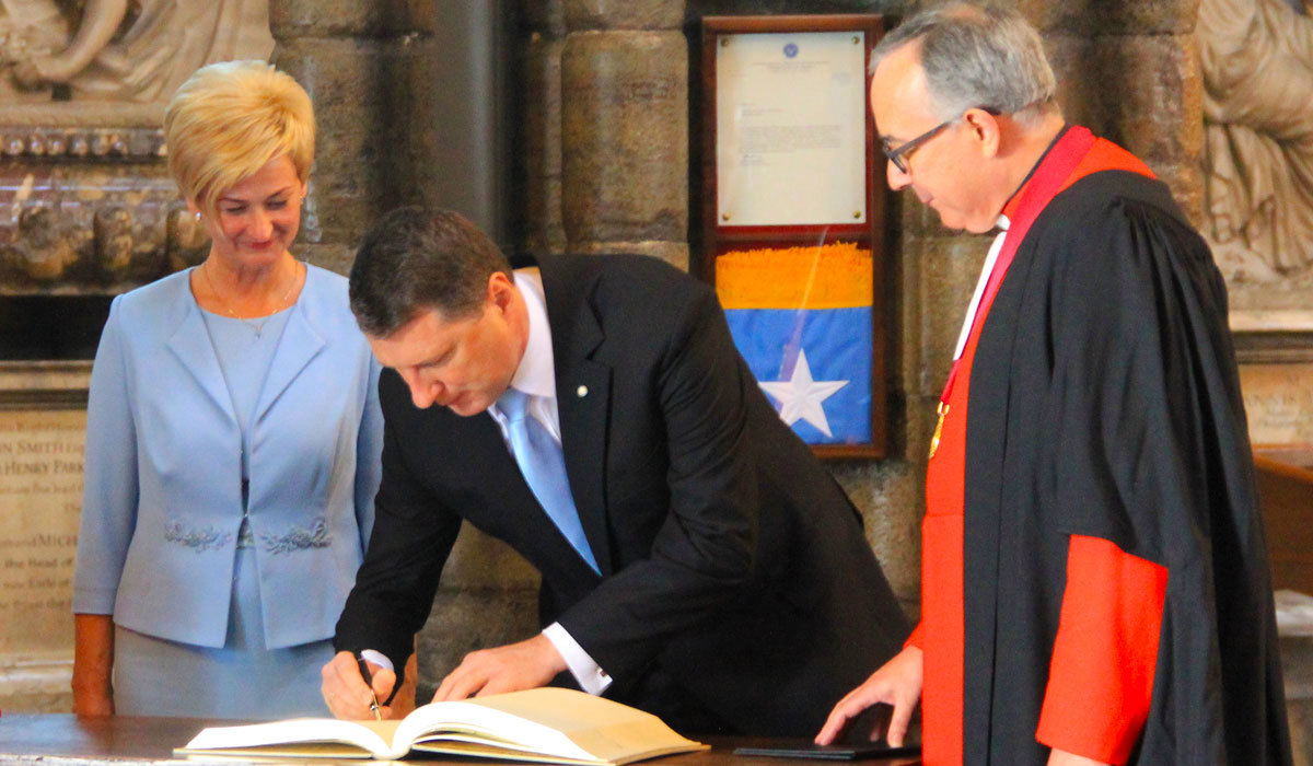 The President of Latvia Raimonds Vejonis and the First Lady Iveta Vejon sign the Abbey's Visitor Book