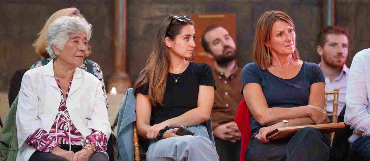 Photograph of seated members of the public listening to a talk within Westminster Abbey
